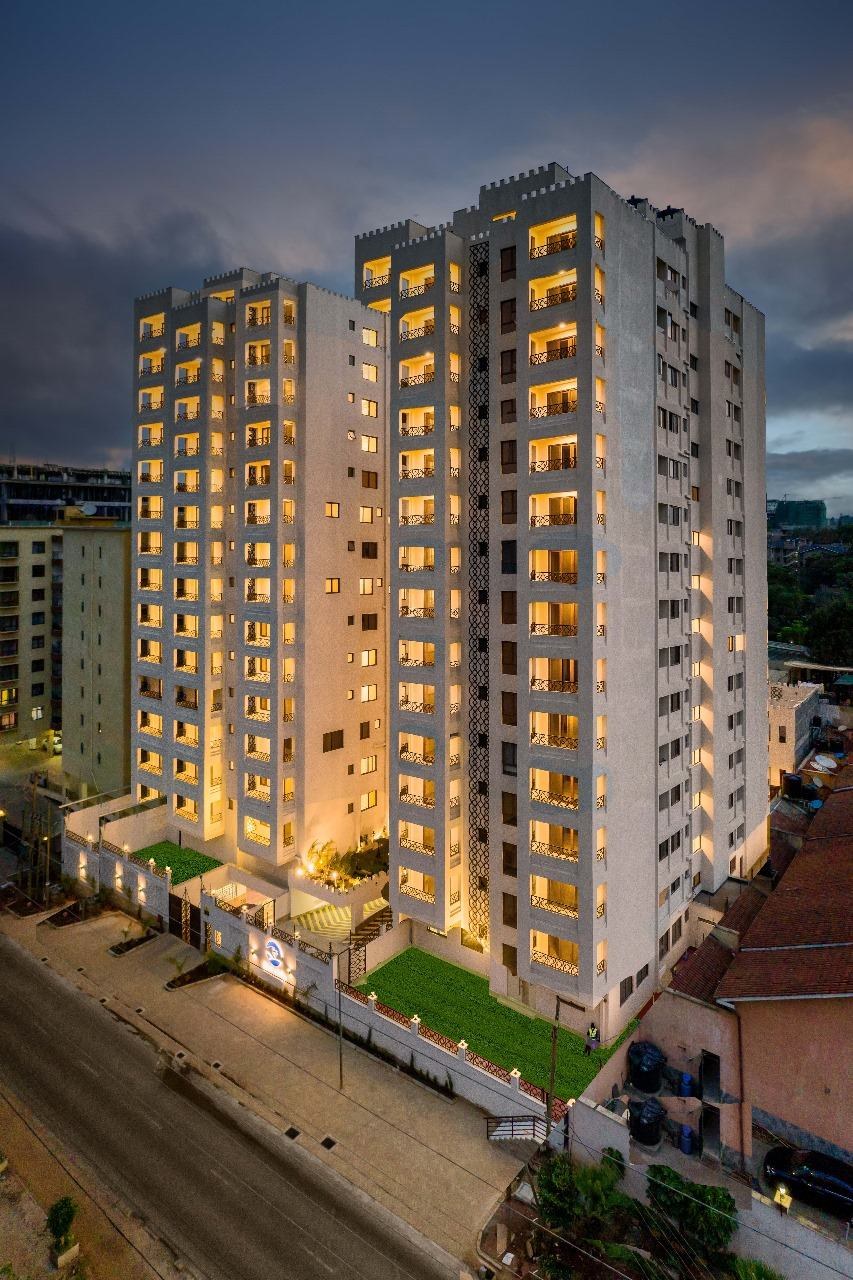 Mixed-use residential tower at dusk